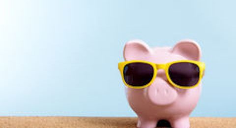 retirement-fund-travel-money-concept-piggy-bank-summer-beach-vacation-copy-space-pink-yellow-sunglasses-55400153